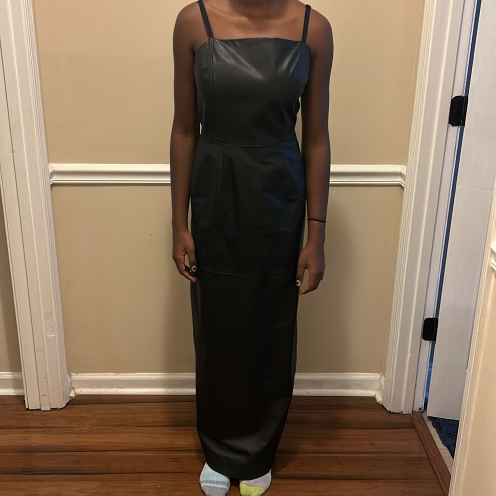 Genuine 100% black leather dress size 6 or small.